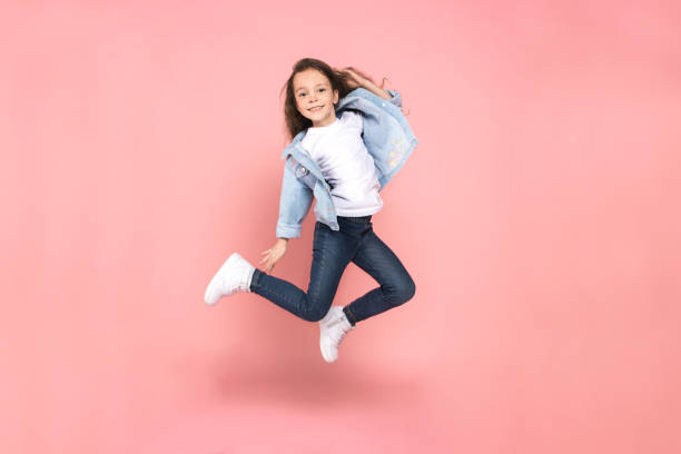 young female teen youth trends studio jumping